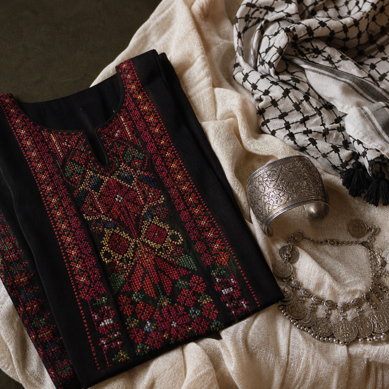 Close view of Palestinian tatreez embroidery and traditional textiles
